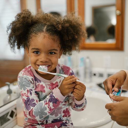 Image of Girl Brushing Her Teeth