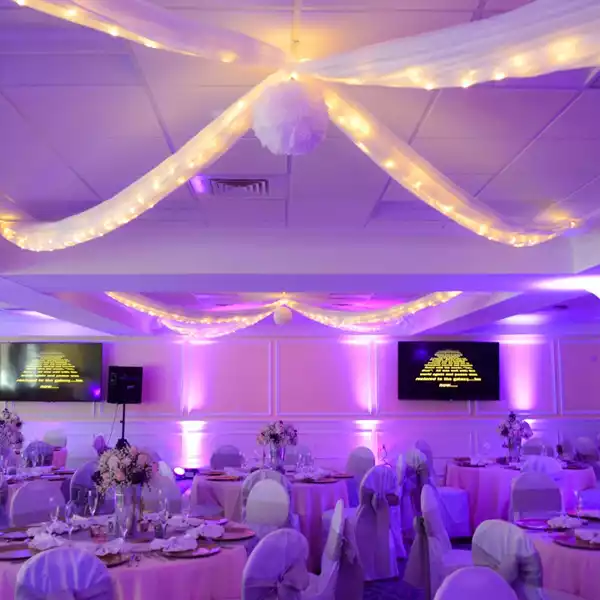 Wedding reception space lit in purple