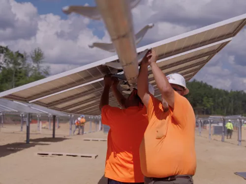 Image of workers installing Solar Panels