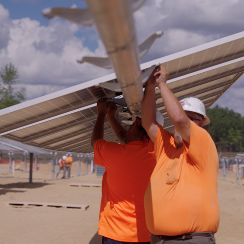 Image of workers installing Solar Panels