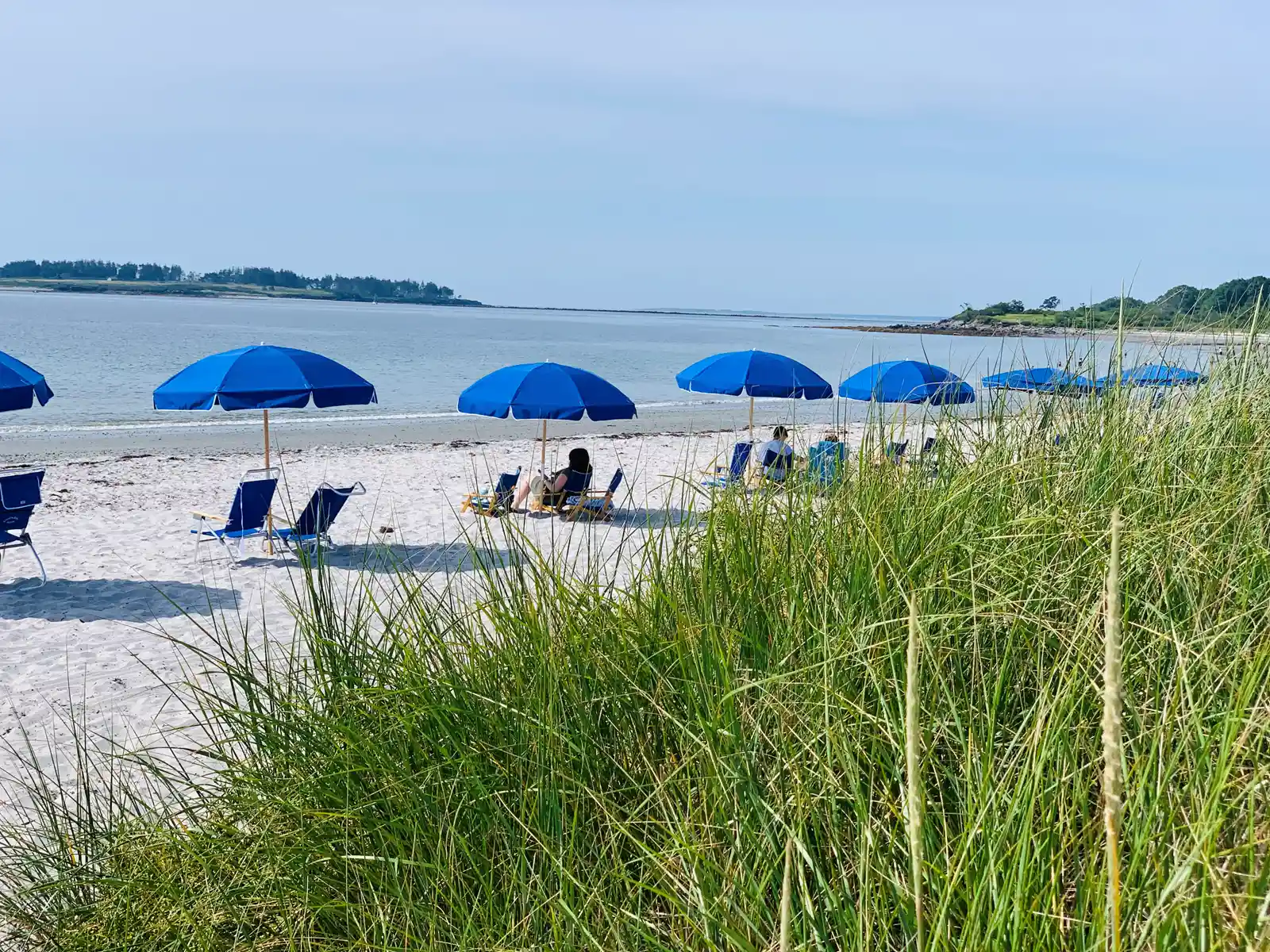Crescent Beach with blue umbrellas 