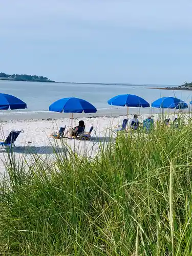Crescent Beach with blue umbrellas 