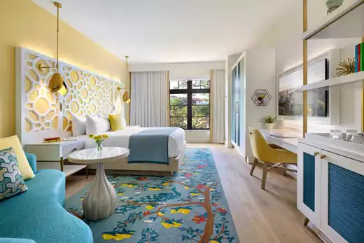 Seating area under pergola next to the outdoor pool